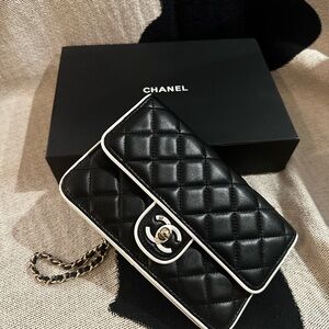 CHANEL Black Quilted Leather Crossbody with White Trim